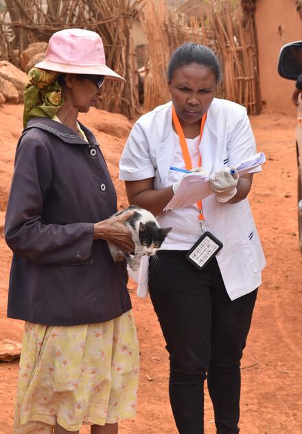 Woman bringing her cat to be vaccinated