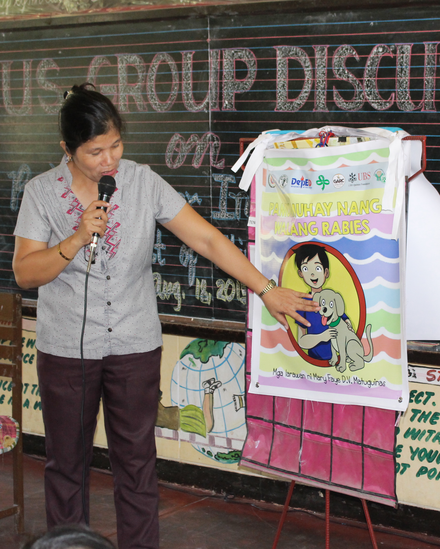 Teacher using the GARC rabies flipchart
