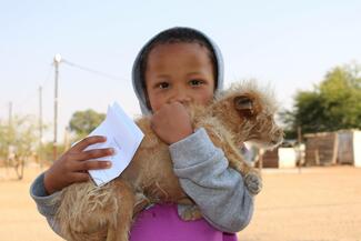 Little Boy and his dog with the vaccination certificate