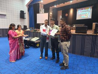 DR. Uma Ram Tamuli, Associate Dean, LCVSc, presenting awards to the Quiz competition winners