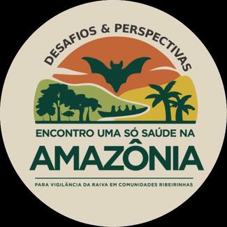 Logo circular do evento 'Encontro Uma Só Saúde na Amazônia', com o título 'Desafios & Perspectivas'. No centro, ilustração estilizada de um morcego sobre uma paisagem com árvores, palmeiras e um barco em um rio, representando a Amazônia. Abaixo, o subtítulo: 'Para vigilância da raiva em comunidades ribeirinhas'.