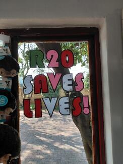 Donation display at Menlyn Vet Practice. A large window that reads 'R20 saves lives'