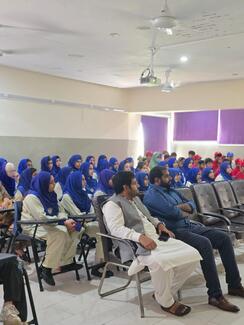 Children and elders actively participating in learning about Rabies.