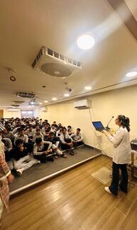 Kids attentively listening to Rabies signs and symptoms. 