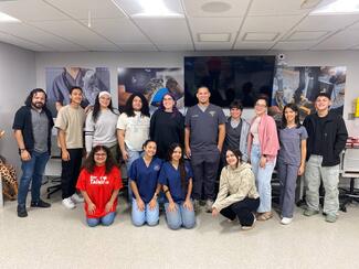 The students of the association with Professor Rodríguez during the workshop activity.
