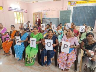 Farmers holding the message - STOP RABIES