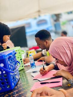 Youth manning the registration desk
