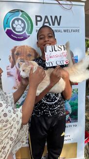 A child with his vaccinated cat