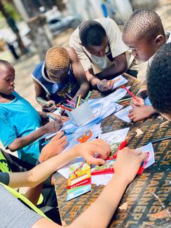 street children learning rabies awareness through art