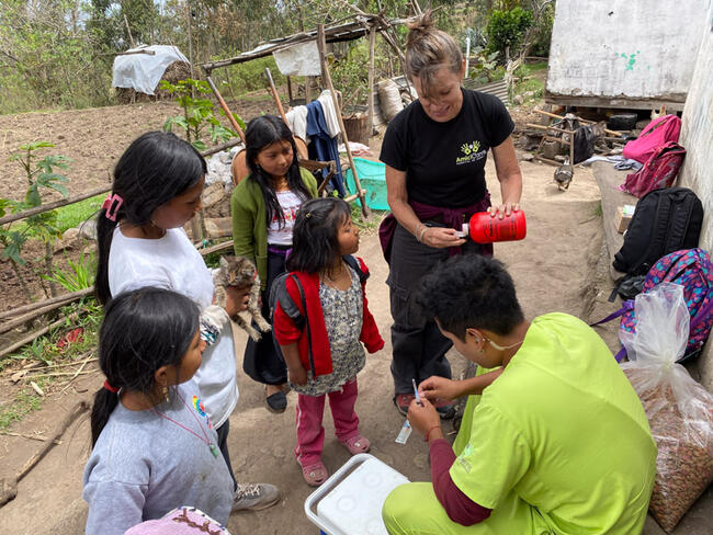 Children bringing their pets for rabies vaccination by Amici Cannis