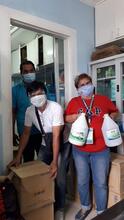 Workers at the City veterinarian office in Philippines receive the donation from the supporters of GARC's Rabies Saviors appeal. 